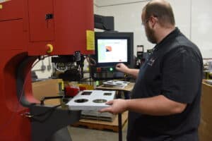 Man using metal cutting machine